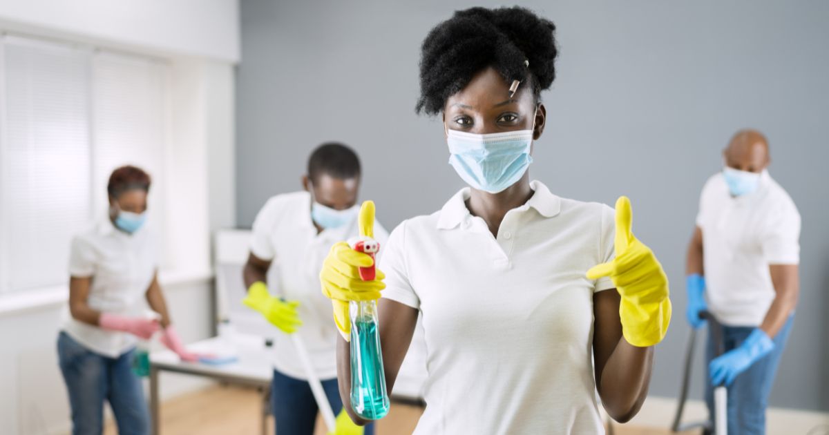 Group of workers cleaning home